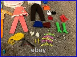 1960's Vintage Barbie doll, case lot of clothes and accessories